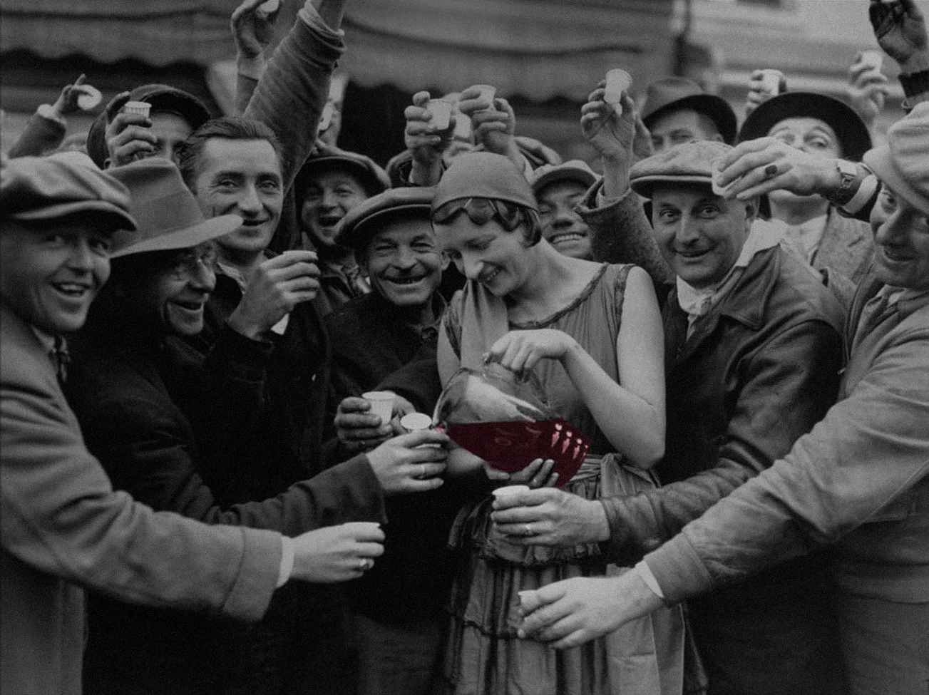 A woman serving wine to the local folk from a village in Rioja.